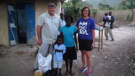 Donna and Eric Van Ee delivering food to sponsor child - Anderson Charles (1)