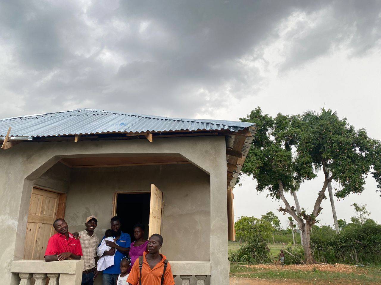 Haiti_Adeline_NewHome_Praying_May2023